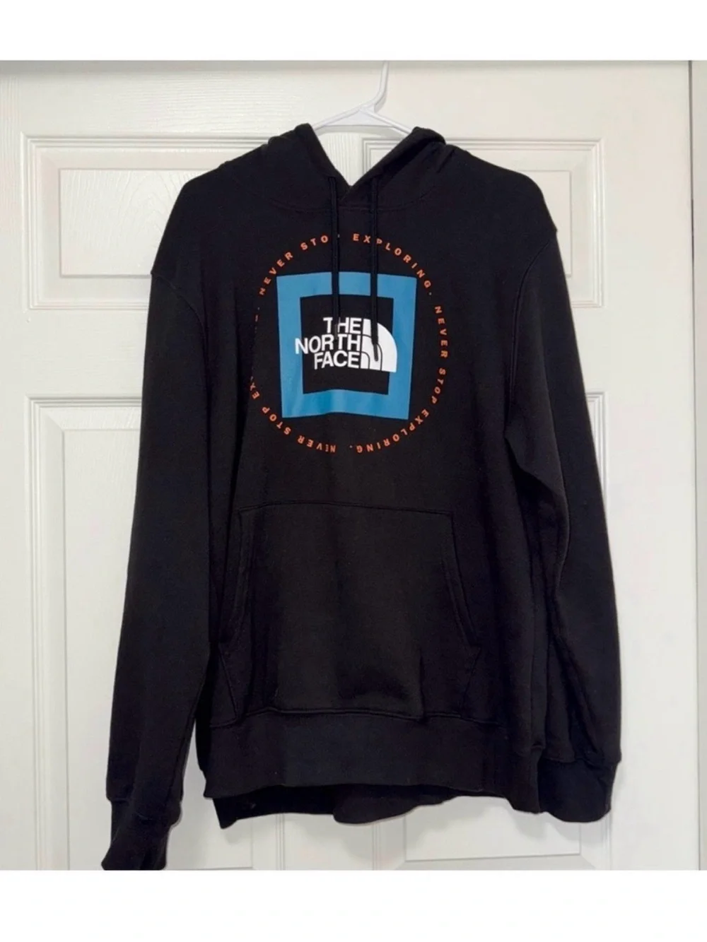 The North Face Black Pullover Hoodie with Blue Logo and Orange Accents